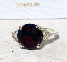 Don't miss this opportunity to own this beautiful gemstone ring crafted in 14k gold filled => Gemstone Type - Garnet, Clear Quartz => Gemstone Cut - Faceted => Gemstone Size - 10 mm, 2 mm => Total Number of Gemstones - 7 => Metal Type - 14k Gold Filled (Tarnish Resistant And Nickel Free) - also available in 925 sterling silver * Please contact me for pricing on a sizes larger than 11 * ~ Feel free to ask me about custom made designs. ❏ Replacements and custom orders : ✪ 925 sterling silver - no Fine Jewelry Rings With Round Gemstone, Anniversary Jewelry With Garnet In Prong Setting, Yellow Gold Rings With Accent Stones, Fine Jewelry Round Cut Gemstone Cluster Ring, Yellow Gold Jewelry With Round Accent Stones, 14k Gold Gemstones For Promise Ring, Ruby Ring With Accent Stones, 14k Gold Ruby Ring With Round Stone For Anniversary, Yellow Gold Crystal Ring With Accent Stones