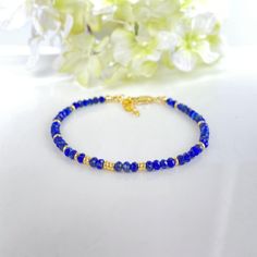 Embrace the beauty of this Lapis Lazuli Beaded Bracelet, a perfect gift for those born in September or anyone who loves the mesmerizing deep blue hues of this stunning stone. The 2X3MM faceted beads shimmer with elegance, while the healing properties of Lapis Lazuli offer spiritual protection and inner peace. This skinny minimalist jewelry piece is not only fashionable, but also carries positive energy and intention. Add this bracelet to your collection for a touch of style and spiritual guidanc Crystal Spiritual, Lapis Lazuli Beads, Spiritual Protection, September Birthstone, Healing Properties, Healing Crystal, Faceted Bead, Blue Hues, Minimalist Jewelry