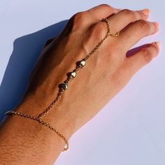 "18 Karat Gold Filled Heart Hand Chain Bracelet length: 7\" + 1.5\" Extension Finger Loop: 4\"  Material: 18 Karat Gold Filled, Hypoallergenic. Tarnish Resistant. Gold-filled does not de-laminate or peel like Gold plated Jewelry nor does it tarnish as readily as silver. Generally speaking, gold filled is better quality and will have a much longer lasting color than plated jewelry. Gold filled jewelry is an excellent option for those who wish to have a product of exceptional quality, beautiful and anti-allergenic, but with prices far lower than solid gold jewelry. We recommend keeping abrasive chemicals away from the jewelry for the items to last. Thank you for visiting and supporting our small business! We hope you will find a stylish piece that speaks to you! ♥ All of our piece our carefu Heart Shaped Metal Bracelets For Wedding, Adjustable Double Heart Bracelet For Promise, Stainless Steel Double Heart Jewelry With Adjustable Chain, Adjustable Chain Bracelet For Wedding On Valentine's Day, Valentine's Day Party Jewelry With Adjustable Chain, Gold Heart Beads Bracelet For Party, Adjustable Heart Bracelet With Extender, Wedding Bracelets With Adjustable Chain For Valentine's Day, Gold Heart Bracelet For Valentine's Day Party