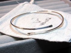 Personalised bangle wrap bangle hammered bangle initial bangle initial bracelet custom bangle hand stamped bangle hand stamped bracelet cuff bracelet bangle bracelet silver bangle bracelet gifts for her adjustable bangle 925 sterling silver custom bangle with words, mother's day gift mothers day bracelet, mothers day jewellery. MATERIAL Round 925 sterling silver bangle (open), 1.8 mm in diameter. SIZE Small size: 2.25 inches in diameter Medium size: 2.5 inches in diameter Large size: 2.75 inches in diameter The bracelet is adjustable. PERSONALIZED INITIAL OR NUMBER Personalise it on either or both edges of the bangle with initials/ numbers (maximum of 3 characters each) HOW TO PERSONALISE 1. Select the initial position. 2. Select the size. 3. Write down the initials in the personalisation Silver Initial Bracelet, Initial Bracelet Silver, Custom Bangle, Personalised Bangle, Handstamped Bracelet, Hammered Bangles, Wrap Bangles, Bracelet Initial, Stamped Bracelet