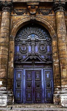 an old building with a large wooden door