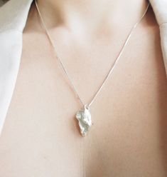 Hey there, it's me again! Let's talk about this beautiful Sterling Silver Botanical Pendant from my Autumn Traces collection. 🌼 First things first, this pendant is all about daintiness and elegance. It's not just a pendant; it's a textured masterpiece that adds a touch of uniqueness to your look. 🌼 The Small Flower Silver Pendant with a chain screams boho style and organic vibes. It's the kind of pendant you'll want to wear every day because it's so darn comfortable and elegant. 🌼 I'm all about combining nature and minimalist jewelry, and this pendant nails it. It's the perfect blend of organic beauty and understated charm. 🌼 Looking for a gift for a nature lover? Well, you just found it! This pendant is a perfect choice to celebrate your love for nature. You know what's cool? You can Nature-inspired Pendant Necklace As Gift For Her, Unique Birth Flower Pendant Necklace, Mother's Day Nature-inspired Pendant Necklace, Lost Wax Casting, Tiny Flowers, Organic Beauty, Gifts For Nature Lovers, Earrings Collection, Flower Pendant