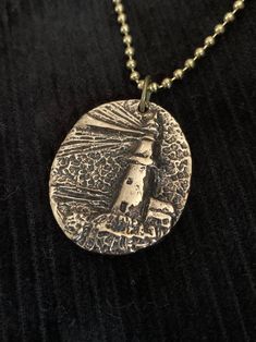 "Lighthouse Pendant Necklace!  An Original Designed Unique Pendant! Size is 1-1/8\" wide by 1-3/8\" tall  Pendant Cast in Solid Bronze 24\" Ball Chain Necklace Price includes USPS First Class Shipping Hand Made in the USA! If you need a gift box or priority mail shipping, please contact us for an upgrade." Adjustable Nickel Free Dog Tag Necklace, Stamped Brass Pendant Necklace, Stamped Metal Necklaces For Gifts, Stamped Metal Round Pendant Jewelry, Stamped Brass Charm Necklaces As Gift, Bronze Jewelry With Lobster Clasp For Gift, Bronze Nickel-free Necklace Gift, Nickel-free Bronze Necklace For Gift, Gift Nickel-free Bronze Necklace