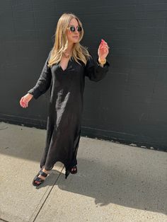 Embrace your inner fashionista with our Positano Maxi Dress. Made from 100% Italian linen, this semi-sheer dress is both light and airy, perfect for those warm summer days. Benissimo! Long sleeve sheer dress Black Light and airy One size fits most Maxi or midi depending on height Model is 5’2, wearing a S Material: 100% Italian linen Wash: Hand wash recommended. Hang to dry. Flowy Linen Dress For Spring, Flowy Linen Spring Dress, Flowy Linen Dress For Spring Day Out, Chic V-neck Linen Dress For Day Out, Casual V-neck Linen Dress For Brunch, Spring Flowy Linen Midi Dress, Spring Daywear Maxi Linen Dress, Flowy Linen Casual Dress For Daywear, Chic V-neck Linen Dress For Beach