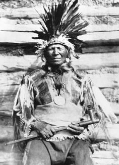 an old black and white photo of a native american man