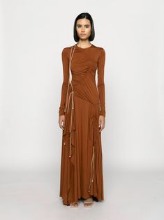 Discover the artful and timeless elegance of the Ina Drawstring Jersey Dress. This A-line cut dress, made from draped Tencel fabric with adjustable drawstring details, exudes sophistication. Its light-weight, soft Tencel fabric and exquisite design make it a chic choice for any occasion. SIZE & FIT • Fits true to s