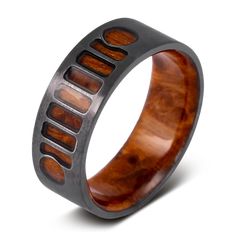 a wooden ring with metal inlays