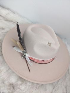 Neutral hat with a pop of the cutest pink bandana band wide brim fedora hat.   This hat is perfect for any cowgirl, country concert, girls trip or for that special occasion!   This hat has a pink bandana band with some layered ribbon, leather cording, and feather cluster along with the cutest cactus pin! There is custom stitching on the side and top brim for an extra special touch. This is a neutral color hat that can be matched to any outfit. This is a cream colored hat made of a polyblend. Thi Casual Hats For Western-themed Spring Events, Casual Spring Hats For Western-themed Events, Trendy Spring Hats For Western-themed Events, Adjustable Felt Hat For Summer Country Events, Adjustable Felt Hat For Country Summer Events, Adjustable Summer Felt Hat For Country Events, Trendy Hats For Kentucky Derby Festival, Trendy Flat Brim Hats For Western-themed Events, Adjustable Country Style Felt Hat For Summer