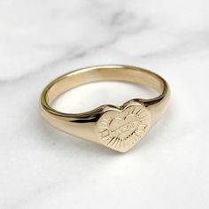 Brand new solid 9ct yellow gold ladies heart signet ring with a unique hand engraved love design  Made to order - 3-4 weeks before being ready to post Ring sizes available - UK - F to U , US 3 to 10 Ring in images is a size T Face size - 8.9mm x 8.9mm  Weight - 4g Size T Hallmarked and highly polished This signet ring comes in a lovely vintage style ring box! Please make contact if you have any questions regarding the item! Follow Heirlooms & Signets on Instagram for the latest updates - https://www.instagram.com/heirloomsandsignets/ Thank You Hannah Heart Signet Ring, Engraved Heart Shaped Yellow Gold Signet Ring, Heirloom Heart-shaped Signet Ring As Gift, Heirloom Heart-shaped Signet Ring For Gift, Classic Heart-shaped 14k Gold Signet Ring, Heart-shaped 14k Gold Signet Ring As Gift, Vintage Style Rings, Love Design, Ring Box