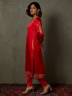 Editor's Note Elevate your ethnic look with our red ari-hand embroidered girija kurta, paired with churidar and a coordinating dupatta. This ensemble combines traditional charm with intricate hand embroidery, perfect for special occasions and celebrations. Fabric: Silk satin Color: Red Components: Kurta, churidar and dupatta Occasion: Festive Note: Product colour may slightly vary due to photographic lighting sources Care: Dry clean only About the DesignerRi Ritu Kumar is one of India’s foremost Slub Silk Anarkali Set With Embroidered Border, Designer Chanderi Palazzo Set With Embroidered Border, Diwali Slub Silk Kurta With Embroidered Border, Red Embroidered Slub Silk Kurta, Designer Red Cotton Silk Churidar, Bollywood Cotton Silk Palazzo Set With Embroidered Border, Traditional Slub Silk Churidar With Embroidered Border, Cotton Silk Sharara With Embroidered Border For Festivals, Traditional Cotton Silk Palazzo Set With Embroidered Border