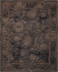 a black and brown rug with an intricate design