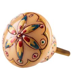 a close up of a decorative knob on a door handle with flowers painted on it