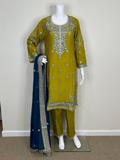 Akbar Aslam Replica Embroidered Pakistani Chiffon dress. Semi Pure Chiffon Embroidered Front, Back, and Sleeves. Semi Pure Chiffon Embroidered Front and Back Borders. Raw Silk Trouser With Embroidery Work. Four Side Border Semi Pure Chiffon Heavy Embroidered Dupatta. Color: There might be slight color variation due to lighting and flashes while the photo shooting. The color may also vary because of different screen resolutions. Wash Care: Dry Clean Only. Note: This is a replica dress of the orig Green Georgette Dresses With Floral Embroidery, Unstitched Embroidered Chiffon Salwar Kameez, Festive Embroidered Chiffon Lawn Suit, Embroidered Chiffon Salwar Kameez For Eid, Traditional Chiffon Lawn Suit With Resham Embroidery, Embroidered Chiffon Dupatta For Eid, Green Chiffon Dupatta With Resham Embroidery, Embroidered Chiffon Lawn Suit For Festive Occasions, Yellow Silk Dress With Chikankari Embroidery