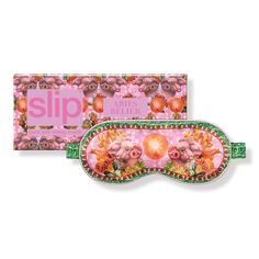 a sleep mask with pink flowers on the side and an advertise box behind it