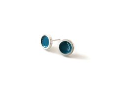 These little stud earrings are totally delightful, a beautiful accessory to wear every day.  These enameled earrings, with their elegant design, will be a perfect original touch for your daily outfit.  The earrings are made of sterling silver and enameled in turquoise.  These earrings are handmade, a beautiful gift for someone you love. ✔︎ Size: 8 mm. / 0.31 inches ✔︎ Material: sterling silver, enamel. ► All my jewelry arrives in a little box ready to give away.  ► All my jewelry is designed and Everyday Round Enamel Earrings, Tiny Blue Minimalist Earrings, Handmade Turquoise Enamel Earrings, Turquoise Enamel Earrings For Gift, Enameled Earrings, Modern Silver Earrings, Enamel Stud Earrings, Stud Earrings Unique, Enamel Earrings