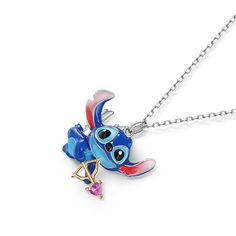 a blue and red necklace with an elephant on it's back end, hanging from a silver chain