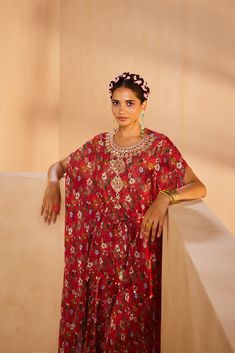 Featuring a floral-printed kaftan and sharara. The kaftan’s neckline is embroidered by hand using a mirror, sequences, and beadwork. The tie-up is accentuated with mirrors and the kaftan hem is accentuated with antique gold coins.From Aneesh Agarwaal's Seher collection.DELIVERY TIMEPlease allow 8-12 weeks for your outfit to arrive.FABRIC DETAILSChinonProfessional cleaning only. Bohemian Kaftan With Dupatta For Festive Occasions, Bohemian Designer Kaftan For Diwali, Bollywood Style Festive Kaftan With Mirror Work, Bohemian Festive Kaftan For Diwali, Bohemian Floral Print Kaftan For Wedding, Festive Bohemian Style Kaftan For Diwali, Festive Bohemian Kaftan For Diwali, Bohemian Dresses For Festive Reception, Anarkali Style Festival Kaftan With Traditional Drape