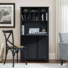 a chair and desk in front of a bookcase with books on it's shelves