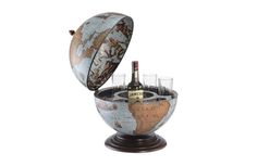 a wine bottle in an old world globe with glasses on the bottom and bottles inside