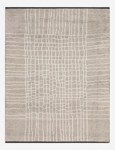 a beige rug with white lines on it