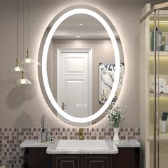 a bathroom with a large round mirror above the sink and lights on the wall behind it