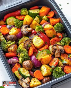 a pan filled with vegetables on top of a table