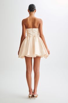 For the hens.Meet the HOLLIE Structured Corset Mini Dress, a harmonious blend of elegance and allure. With its princess neckline, this dress exudes timeless sophistication, while the corset-shaped bodice ensures a flattering and feminine silhouette. Adorned with gathered bust cups, it adds a touch of romance and charm. The gathered circle skirt enhances movement and adds a playful flair to your ensemble. Lined for comfort and featuring a tulle underlay for added volume and structure, the Hollie Elegant A-line Mini Dress With Structured Boning, Chic A-line Mini Dress With Corset Back, Luxury Boned Bodice Mini Corset, Luxury A-line Mini Dress With Boned Bodice, Chic Gold A-line Mini Dress, Corset Mini Dress, White Dress Party, Capsule Outfits, Beige Dresses