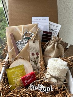 a box filled with lots of different types of things to put in it on top of a table