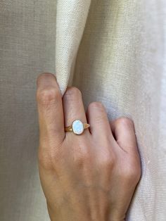 Simple opal stone set on 14k yellow gold. Metal: 14K yellow gold Stone: Synthetic Opal Stone Shape: Oval Stone Size: 8mm x 10mm 1.4mm band width. Ready to ship size 7. Synthetic Opal, Colored Gems, Gold Stone, Opal Stone, Oval Stone, Opal Ring, Engagement Ring Wedding Band, Opal Rings, Stone Settings