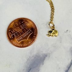 "A beautiful 14K solid yellow gold tiny etched lucky elephant pendant charm. It has a soldered ring to attach to a bracelet or a necklace. The very delicate pendant measures 6.1mm tall with bail and without the soldered ring and 6.9mm wide. It can be used as a necklace pendant or a bracelet charm and would make a perfect gift. The pendant can be paired with a shiny 14K Yellow Gold 1.2mm cable link chain in either 16\" or 18\" length or with a 16\" 14K gold-plated cable link chain. All items come Dainty 14k Gold Filled Engraved Charm Necklaces, Dainty Engraved 14k Gold Filled Charm Necklaces, Dainty 14k Gold Filled Engraved Charm Necklace, Dainty Nickel Free Yellow Gold Jewelry, Dainty Gold Hypoallergenic Charms, Dainty Small Charms Jewelry, Small Dainty Charms Jewelry, Dainty Hypoallergenic Gold Charms, Dainty 14k Gold Hypoallergenic Charm Necklaces