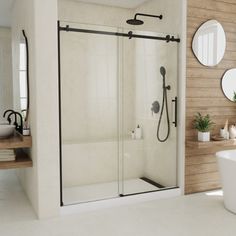 a bathroom with a tub, sink and shower stall in the middle of it's walls