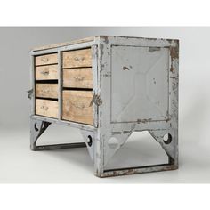 an old metal and wood cabinet with drawers on wheels is displayed against a white background