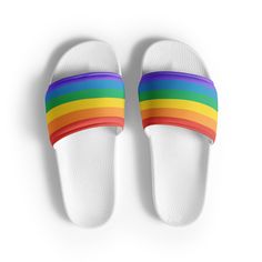 Rainbow LGBTQ+ Women's Slides. A must-have for the summer: these women's slides. A pair of these will keep you comfy throughout your day of beach or pool activities, thanks to the cushioned upper strap and the textured footbed.  * Cushioned and durable faux leather upper strap * Lightweight polyurethane (PU) outsole * Contoured, textured footbed * Spot clean only * Printed, cut, and handmade * Blank product sourced from China Important: This product is available in the following countries: United States, Canada, Australia, United Kingdom, New Zealand, Japan, Austria, Andorra, Belgium, Bulgaria, Croatia, Czech Republic, Denmark, Estonia, Finland, France, Germany, Greece, Holy See (Vatican city), Hungary, Iceland, Ireland, Italy, Latvia, Lithuania, Liechtenstein, Luxemburg, Malta, Monaco, Ne Multicolor Slip-on Slides For Summer, Casual Slip-on Flip Flops With Round Toe, White Summer Slippers For Leisure, White Summer Leisure Slippers, White Synthetic Flip Flops For Leisure, White Slide Flip Flops For Leisure, White Flip Flops For Leisure In Summer, White Summer Flip Flops For Leisure, Slip-on Flip Flops With Round Toe For Vacation