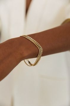 The Capri Curb Chain Collection is an absolute timeless classic — then, now, always. Elevated with subtle detail in the chain, each bracelet is made from a long chain, so each piece is one of a kind. This bracelet is available with or without the single floating 0.1cw diamond set in the chain. Layer up with our Familia Cuban Bracelet. 14k solid gold - always Weighs about 5 grams Chain is approximately 2.5mm thick Diamond Clarity: SI 1-2 We offer custom sizes upon request. Please add the Custom S Classic Curb Chain Jewelry For Everyday Luxury, Classic Curb Chain Bracelet, Classic Cuban Link Necklace Tarnish Resistant For Everyday, Classic Cuban Link Bracelets For Everyday, Classic Everyday Cuban Link Necklace, Tarnish Resistant, Classic Cuban Link Bracelet For Everyday, Elegant Cuban Link Bracelet For Everyday, Classic Cuban Link Bracelet With Box Chain, Classic Chain Tennis Bracelet