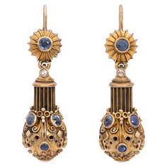 This pair of handmade, vintage diamond, blue sapphire, pearl, and 18 karat rose gold earrings by renowned goldsmith Elmar Seidler, who was born in Konstanz and based in Munich, showcases his exceptional mastery of technique and skill in manipulating gold. Crafted in Germany in 1950, the earrings measure approximately 1.6 inches in length, making them versatile for both casual daytime wear and glamorous evening events. Elmar Seidler (1904 -1976) was a renowned German goldsmith and jeweler known f Earring Video, Vintage Inspired Earrings, 18k Gold Earrings, White Gold Earrings, Brown Diamond, Gold Earrings Dangle, Rose Gold Earrings, Vintage Diamond, Cultured Pearls