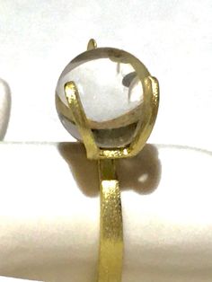 Rare 14k BRUTALIST MODERNIST POOLS OF LIGHT ROCK CRYSTAL GLASS ORB Ring!  in excellent condition! arrives in jewelry case and can be gifted immediately! crafted in solid 14k yellow gold and comes with 10 different gemstone spheres - each approx 10mm. there are natural gem orbs:  -moonstone with blue sheen (the moonstone is approx 7.55Ct please see photo for its carat weight), -South Sea Pearl wit diamond, -agate - eye like pattern( please see photos),  -lapis,  - golden sand stone,  -amethyst, Formal Rings With Si Clarity And Round Cut, Formal Round Cut Ring With Si Clarity, Gold Moonstone Ring With Polished Finish For Promise, Unique Formal Ring With Tension Setting, Unique Formal Rings With Tension Setting, Modern White Gold Moonstone Ring, Modern Round Crystal Ring For Formal Occasions, Modern Gold Moonstone Ring For Formal Occasions, Elegant Hand Forged Moonstone Ring Gift