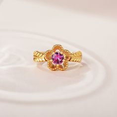 The fashion ring features a sparkling center stone with sculpted petals of a flower, and meaningful engravings inside the band. Give her this masterpiece as a gift to make her feel loved, cared for and pampered.Weight: 3.5 gHeight: 10.25 mmMaterial: 925 SilverPlating Color: Yellow Gold Elegant Flower-shaped Diamond Cut Rings, Elegant Flower Rings For Anniversary, Elegant Flower-shaped Rings For Anniversary, Fine Jewelry Flower Ring With Accent Stones, Fine Jewelry Floral Rings With Accent Stones, Flower-shaped Rings With Accent Stones For Anniversary, Flower Shaped Rings With Accent Stones For Anniversary, Flower-shaped Anniversary Rings With Accent Stones, Gemstone Flower Ring For Anniversary