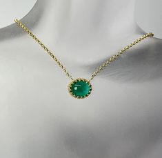 Cabochon Cut Oval Shape Natural Green Emerald  The gemstone weighs 3.20 carat and measures 10.5x9x5mm  It is set in a 14 karat yellow gold ornamental center frame of a necklace.  The rolo design chain weighs 1.4 grams and it is 10 karat yellow gold with a spring ring clasp. Yellow Gold Gemstone Cabochons Fine Jewelry, Yellow Gold Gemstone Cabochons For Fine Jewelry, Elegant Yellow Gold Jewelry With Cabochon, Elegant Yellow Gold Cabochon Jewelry, Luxury Yellow Gold Oval Cabochon Gemstones, Yellow Gold Cabochon Round Pendant Jewelry, Yellow Gold Round Cabochons Fine Jewelry, Elegant Gemstones With Bezel Setting For Formal Occasions, Yellow Gold Round Cabochons For Fine Jewelry