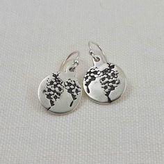 Cherish the memories of those you hold dear with these handcrafted Sterling Silver Forget Me Not Flower Earrings. Featuring an artist-original engraving of the delicate forget me not flower, these earrings are more than just jewelry - they are a heartfelt symbol of remembrance. A black patina enhances every detail of the design, bringing the flower's beauty to life. The asymmetrical heart earrings measure approximately 7/16" wide; the circle earrings measure approximately 1/2" and the rectangula Mother's Day Sterling Silver Birth Flower Earrings, Sterling Silver Flower Charm Earrings As Gift, Delicate Sterling Silver Birth Flower Earrings, Sterling Silver Flower Charm Earrings For Everyday, Sterling Silver Flower Pendant Earrings As Gift, Sterling Silver Earrings With Flower Charm For Everyday, Dainty Sterling Silver Birth Flower Earrings, Mother's Day Nickel-free Sterling Silver Flower Earrings, Nature-inspired Earrings For Anniversary