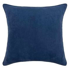 a dark blue pillow on a white background