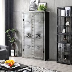 a living room filled with furniture and a metal cabinet