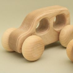 a wooden toy car sitting on top of a table