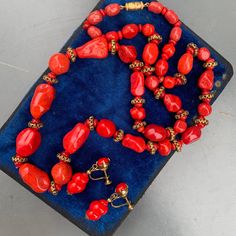 Vintage ~ Art Deco ~ hand knotted ~ pate de verre ~ Lipstick red ~ art glass bead beaded necklace with gold gilded filigree beads in between ~ necklace comes with screw-back earrings , I am not sure if they are original to the necklace but will be added along with necklace ~ Necklace has barrel clasp Dates 1920's -1940's ~ Unsigned but probably French in origin Measurements : Necklace is 27 inches in length x 1/2 inches max width ~ Largest glass bead is approx 7/8 inches x 1/2 inches max width ~ Vintage Red Gemstone Beads, Vintage Single Strand Red Coral Jewelry, Vintage Style Single Strand Red Coral Jewelry, Vintage Style Jewelry With Single Strand Red Coral, Vintage Red Coral Single Strand Jewelry, Artisan Red Faceted Beads, Artisan Red Czech Glass Jewelry, Vintage Red Faceted Beads Jewelry, Vintage Red Gemstone Beads Jewelry