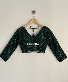 Stunning emerald green/ dark green blouse.  It has thread and transparent sequin embroidery on net fabric. This blouse is a versatile piece and can be paired with saris and lehengas.  DEATILS * V neck font and back * 3/4 th sleeves * Padded * Back hooks for closure This blouse can be made in ANY color. Please send me a convo if you need it in a different color.  MEAUREMENTS & CUSTOMIZATIONS This blouse can be purchased in your standard sizing and pattern. Please choose your Chest Size (measured in inches) from the drop-down box.  For custom sizing please include the below measurements in the the notes to whenever you placed the order.  * Chest size: * Waist size: * Blouse Length: * Sleeve Length: * Bicep: * Arm-hole: * Front Neck Depth: * Back-Neck Depth:  SHIPPING DETAILS  Please leave yo Dark Green Embroidery Blouse, Green Anarkali Long Sleeve Choli, Green Choli With Mirror Work For Party, Party Green Choli With Mirror Work, Festive Green V-neck Blouse Piece, Semi-stitched Green Choli For Party, Green V-neck Blouse With Pallu, Green Embroidered Party Blouse, Green Long Sleeve Top For Wedding