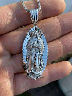 Gorgeous handmade Virgin Mary pendant
Will never turn green! SOLID 925 SILVER...Great investment!
1x2"Pendant weighs 9 grams!VERY DETAILED.Amazing handmade pieceYou can buy pendant alone or with choice of  2.5mm solid 925 silver chain.Chain is Made in Italy & comes in 18-30"If you look to buy only pendant it will fit most chains up to 5mm thick...would look really nice on a tennis chain too! Silver Our Lady Of Guadalupe Pendant Jewelry, Spiritual Silver Necklace With Our Lady Of Guadalupe, Mary Guadalupe, Virgin Mary Pendant, 10k Gold Chain, Red Stone Ring, Tennis Chain, Gold Chain With Pendant, White Gold Chains