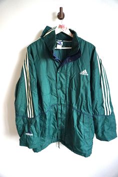 Jacket details: * Green ADIDAS windbreaker outwear jacket * Zipper and snap buttons on front * Two pockets * Condition: Perfect vintage condition, but zipper is broken, thats why price reduced.  Length: 37 " / 86cm Armpit to armpit: 28" / 68 cm sleeve: 25" / 62cm Label size: D-7 (L) Feel free to message me with any questions Green Adidas, Adidas Windbreaker, Adidas Vintage, Ski Suit, Ski Suits, Outwear Jackets, Vintage Adidas, Warm Winter, Favorite Outfit