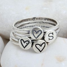 "Do you have two kids and want a simple ring to remind you of your love for them each day? Then this is the perfect gift for you, or someone you love. Also, makes a great couple ring or BFF ring. Or if there's only one in your life, mix one initial ring with a heart or cross for the second band. Create your personalized set today! **This listing is for a set of two sterling silver stackable initial rings. Each ring has either one initial or symbol. The symbol rings include a heart, a cross or th Personalized Adjustable Stackable Rings, Everyday Hand Stamped Stackable Rings, Everyday Stackable Rings For Valentine's Day, Heart Shaped Stackable Rings For Everyday, Cute Adjustable Ring For Everyday, Cute Adjustable Everyday Rings, Personalized Everyday Stackable Rings, Personalized Stackable Rings For Everyday, Personalized Everyday Meaningful Rings