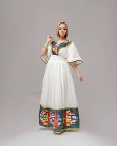 This ሀበሻ Kemis is a true masterpiece of Ethiopian fashion that features a unique and intricate Tilf design. The Tilf design is a beautiful and traditional Ethiopian pattern that adds a touch of uniqueness and sophistication to the overall design. The dress is elegant and sophisticated, with a flattering and comfortable fit that accentuates the beauty of the wearer. The Tilf design on the dress is intricate and beautiful, a testament to the skill and craftsmanship of Ethiopian artisans. The dress Ethiopian Pattern, Ethiopian Coffee Ceremony, Ethiopian Fashion, Eritrean Dress, Habesha Dress, Ethiopian Traditional Dress, Ethiopian Dress, Habesha Kemis, Exquisite Design