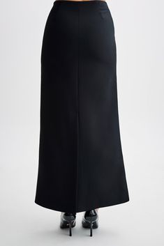 Maximum suiting.The MICAH Suiting Maxi Skirt epitomises timeless sophistication with a modern twist. Designed with a high waist and straight shape, it exudes effortless elegance. Its maxi length ensures a graceful silhouette for any occasion. Enhanced with contrast mock pocket detailing, side zipper, and centre back vent, this skirt offers both style and functionality. Whether paired with a blouse for a polished office look or the matching Micah Contrast Suiting Strapless Top, for a chic evening Black Straight Silhouette Bottoms For Evening, Chic Straight Silhouette Evening Bottoms, Elegant Straight Silhouette Bottoms For Evening, Sleek Relaxed Maxi Skirt, Elegant Evening Bottoms With Straight Silhouette, Elegant Straight Silhouette Evening Bottoms, Workwear Midi Skirt With Side Slits, Modern Formal Midi Skirt, Midi Skirt With Side Slits For Work