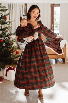 * NOTE: We recommend sizing down 1 size in this dress The Margo Midi Dress offers timeless holiday style. Constructed from a classic red and green plaid print, this dress features a smocked panel in the back and a large beautiful bow in front. Finished with a hidden back zipper and long sleeves, you will look and feel Dark Green Christmas Dress, Plaid Christmas Dresses, Mom And Daughter Christmas Dresses, Christmas Dress Woman, Modest Christmas Dresses, Womens Christmas Dresses, Holiday Card Photo Ideas, Womens Winter Dress, Fall Maxi Skirt Outfits